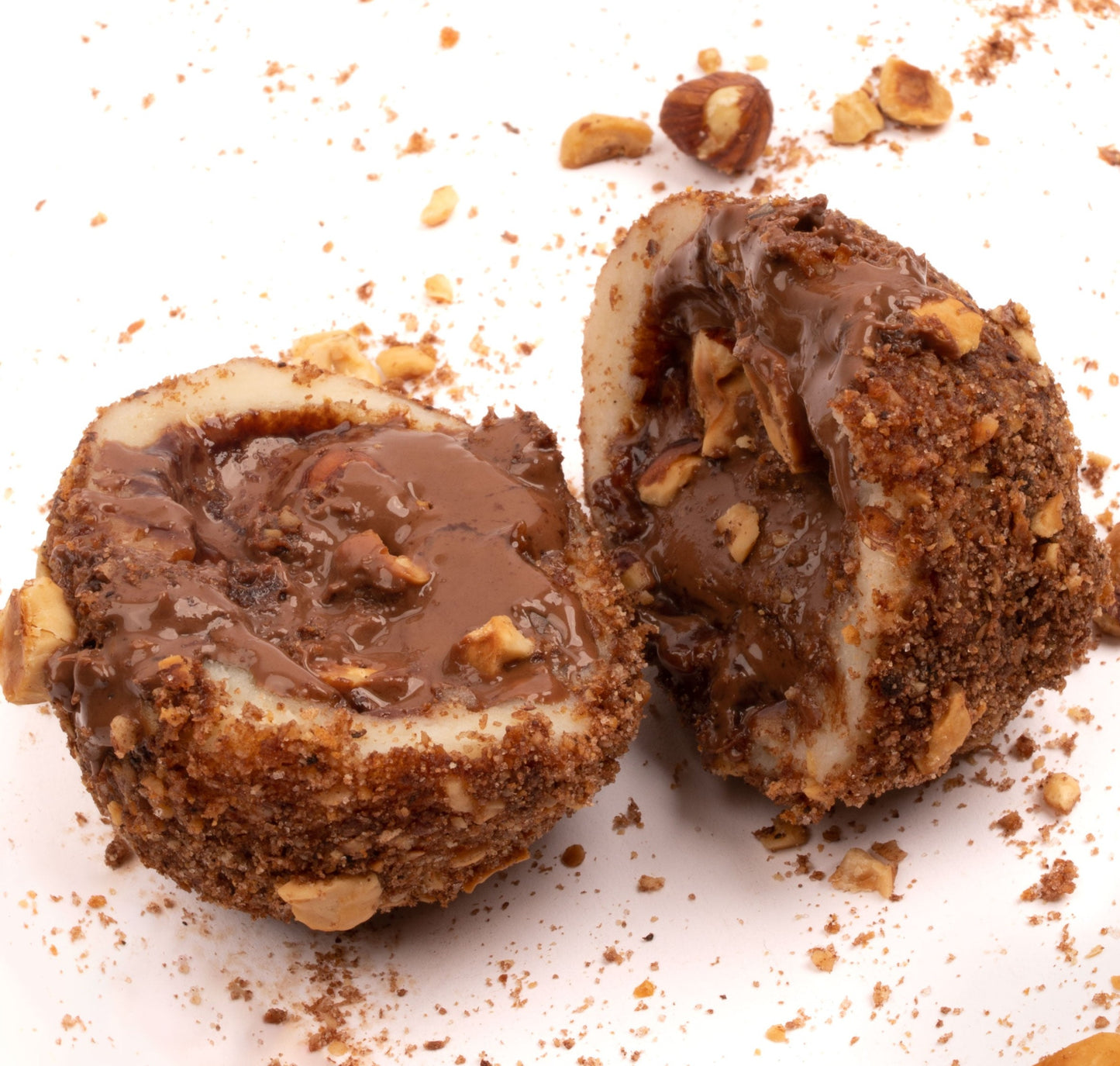 Nutella knedla is made for chocolate lovers. We start by filling our signature potato dough with the original Nutella spread known for its rich taste of hazelnut and chocolate. We then hand-make a knedla ball and coat it with more hazelnuts and cacao! Scrumptious!